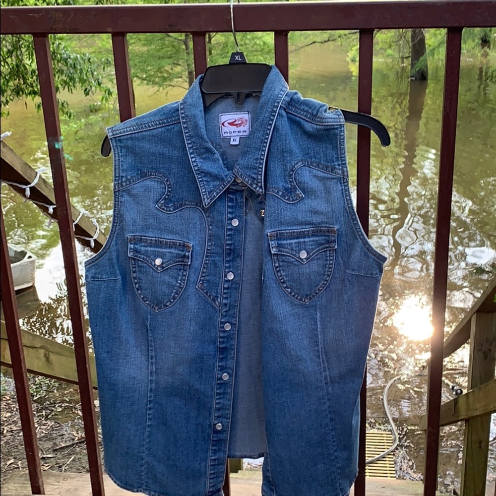A sleeveless jean jacket